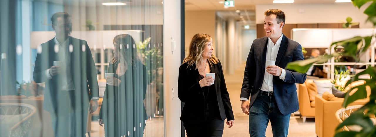 People walking in an open office environment.