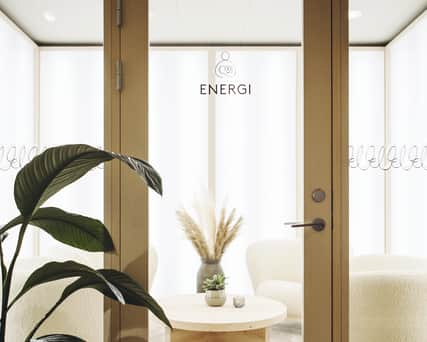 Two people riding on bikes.