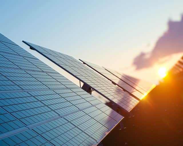 Angled shot of solar panels in a row.